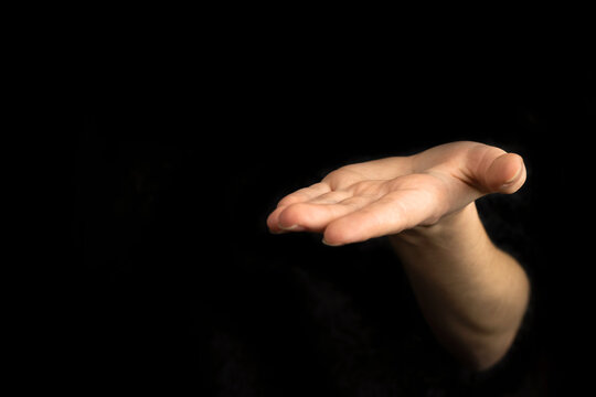 Giving Hand Gesture, Empty Woman Hand On A Black Background