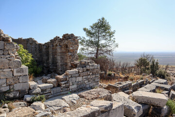 ruins of the ancient city Priene in Turkey with beautiful valley landscape on the background