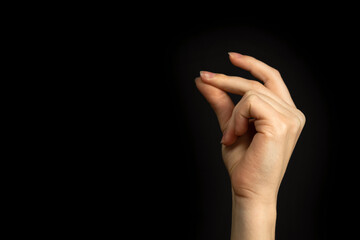 Hand gesture snapping fingers, easy sign and symbol on a black background