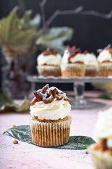 Maffin cake cupcake with white cream autumn green leaf