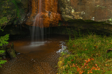 Bukovy waterfall near Jedlova station in autumn color wet morning