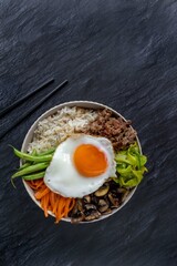 Traditional Korean dish- bibimbap: rice with vegetables and ground beef