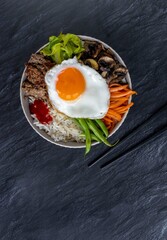 Traditional Korean dish- bibimbap: rice with vegetables and ground beef