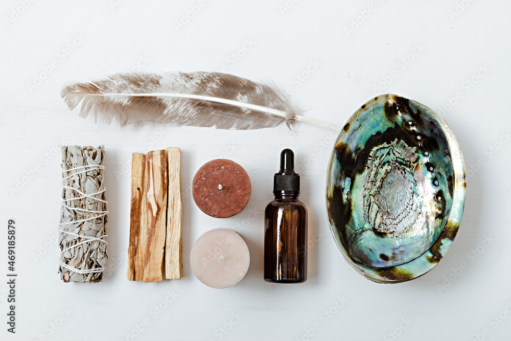 Wall mural Smudge kit with white sage, palo santo, abalone sea shell. Natural elements for cleansing environment from negative energy, adding positive vibes. Spriritual practices, witchcraft concept