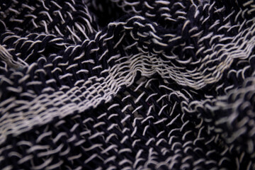 Black and White Handicraft Clothes on White Background .
Close up Detail of Hand Woven Cotton Scarf ,
Design texture and Pattern by Artisans in Northern Villages of Thailand