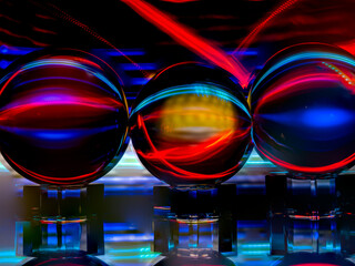 Silvery White and Neon Red Light Painting Reflect in the Crystal Spheres