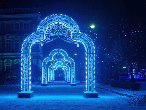 Saint Petersburg christmas. Russia winter. Christmas arches on streets of St. Petersburg. Arches with New Year's illumination. Fragment of winter palace. Saint Petersburg tourism. New Year in Russia - Powered by Adobe
