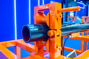 Production of multilayer pipes. Manufacturing of pipeline. Tube inside rolling mill. Equipment for testing pipes in production. Pipeline painting process. Pipe production process. Orange vise