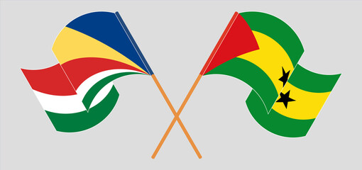 Crossed and waving flags of Seychelles and Sao Tome and Principe