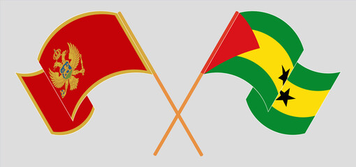 Crossed and waving flags of Montenegro and Sao Tome and Principe