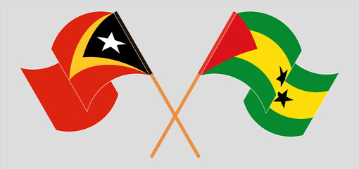 Crossed and waving flags of East Timor and Sao Tome and Principe