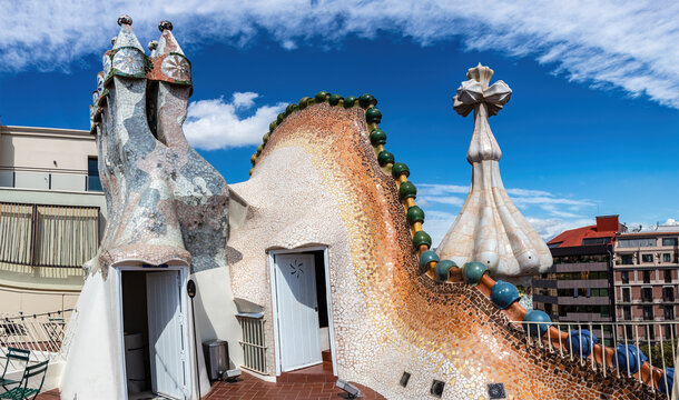 The arched roof and chimney of Casa Batllo in Barcelona, the building, Antoni gaud&iacute;. The facade is decorated with ceramic mosaics.