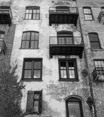 Old weathered and worn wall with windows