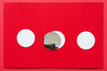 red paper background with circles