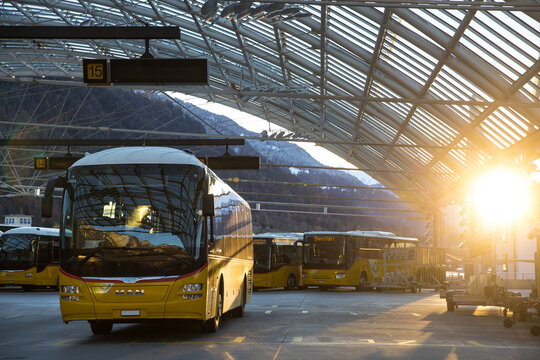 chur, graubuenden,switzerland - 07 11 2021: swiss postauto buses in a swiss transportation station