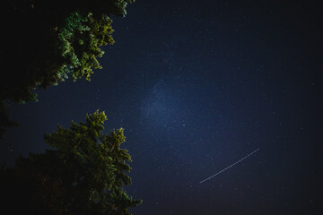 Fototapeta na wymiar Perseid Meteor Streaking Across Night Sky