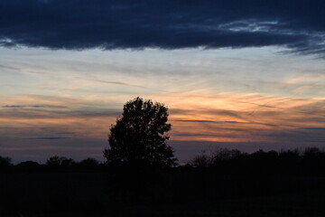 Sunset Over a Rural Field