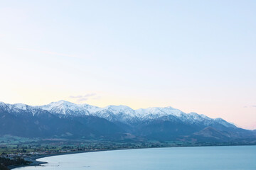 Snow covered mountains by the Ocean