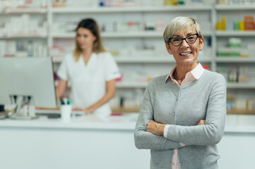 Smiling senior female patient in a pharmacy