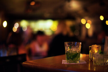 Bokeh bar  background, blurred multicolored lights Table in the foreground for your product, cocktail