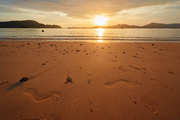 Beautiful landscape. Sea sand beach at sunset time.