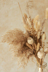 Bouquet of beautiful beige dried flowers. Home decoration concept.