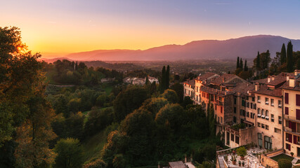 Scenic view of Asolo (Treviso province, veneto, Italy) ancient buildings and countryside at sunset...