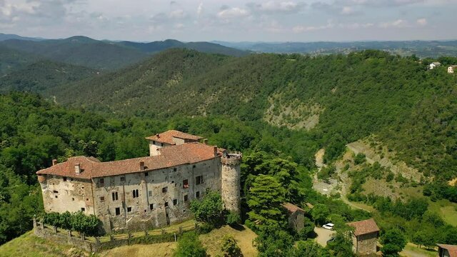 Aerial drone view over the Promessi Sposi castle, Casaleggio Boiro , sunny Italy