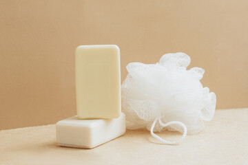 Fototapeta na wymiar Handmade soap from natural raw materials washcloth beige background. Organic cosmetics. Spa health concept n