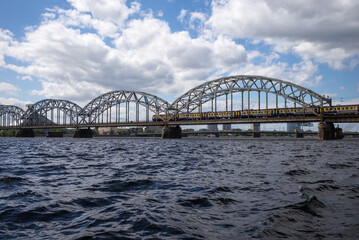 Fototapeta na wymiar Railway bridge over Daugava River in Riga Latvia