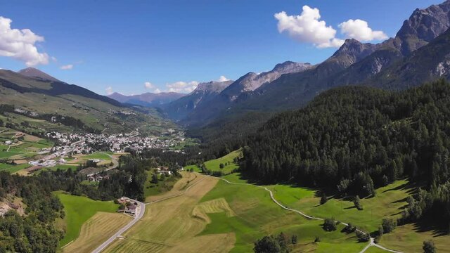 Aerial: swiss town and valley from the air 1