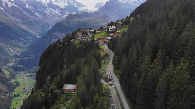 Aerial: little mountain train in the Jungfraujoch region 1