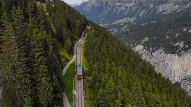 Aerial: little mountain train in the Jungfraujoch region 2