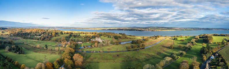 Panorama over Powderham Castle and Park from a drone in Autumn Colors, Exeter, Devon, England, Europe