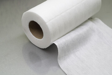 Universal white fabric napkins for cleaning in a roll. Bobbin with napkins for dispenser. Selective focus