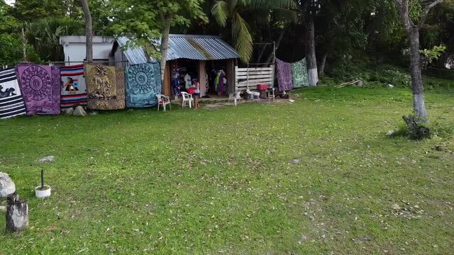 A Woman Coming Out from a Handcraft Shop in a Small Town within the Jungle
