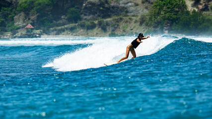 surfer on a blue wave.