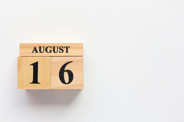 Hello August, Cube wooden calendar showing date on 16 August. Wooden calendar with date on a light background.