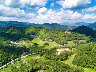 Fototapeta na wymiar Aerial photography of magnificent scenery of blue sky and green mountains at Kunlun Pass in Nanning, Guangxi, China