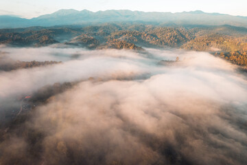 Flying above the clouds sunrise and fog