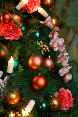 Decorative decorations on a festive Christmas tree. Bright New Year background. vertical frame
