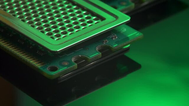 Kit of computer memory chip isolated on green light mirror background. PC upgrade or repair concept. Random Access Memory abbreviated as DDR SDRAM. Computer hardware, electronic concept