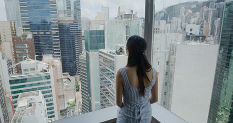 Woman look around the city in Hong Kong