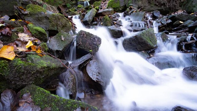 Waterfalls in the beautiful autumn nature. 4k B roll of Time lapse. White water time lapse on a slider.