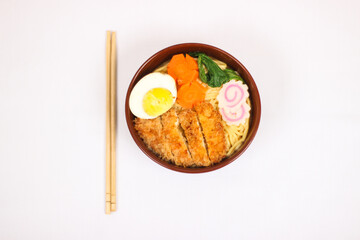 delicious ramen and a pair of chopsticks isolated on white background