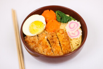 delicious ramen and a pair of chopsticks isolated on white background