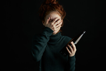 woman with bottle of alcohol bruises under eyes changes depression dark background