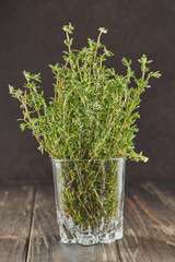 Bouquet of fresh thyme in glass, herbs to add to food