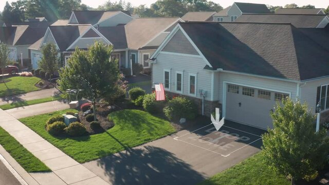 Aerial drone delivers package to Drop Zone at house home in America, USA. Motion graphic visual effect.