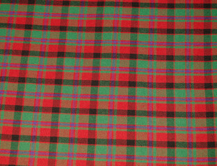 Checkered Skrunda national costume in green, red, black and blue, Latvia.